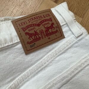 Levi’s White 501 Shorts - Size 24 raw hem